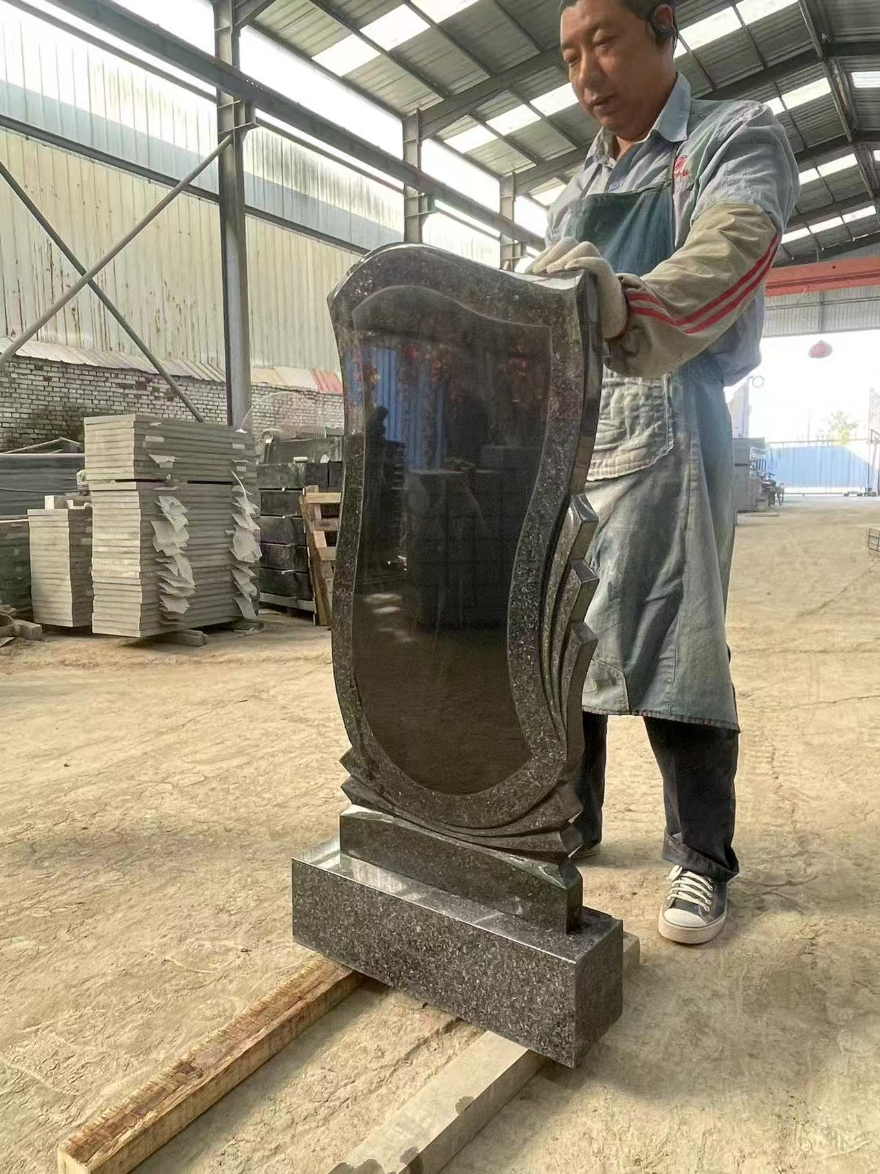 black granite headstone trimed with brown granite.jpg